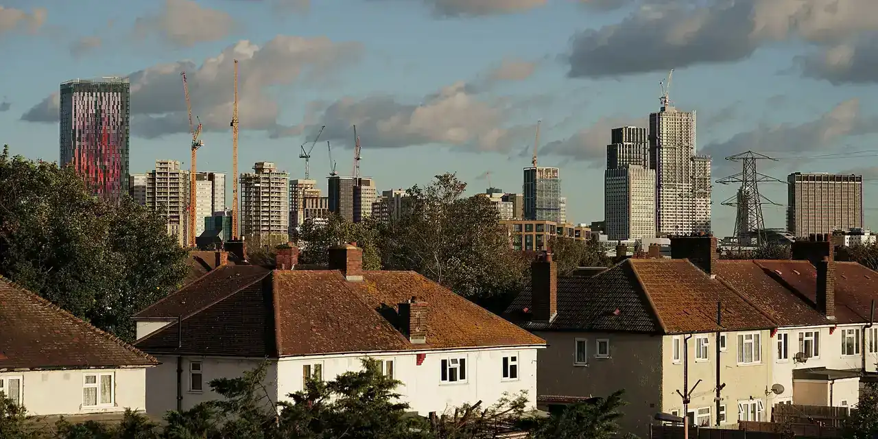 The Croydon skyline rising behind suburban rooftops